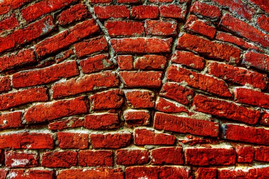 Vivid red brick wall texture.