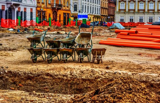 Construction site with wheelbarrows in Timisoara, Romania.