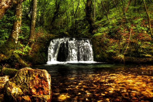 Waterfall in the forest, Bigar, Romania.