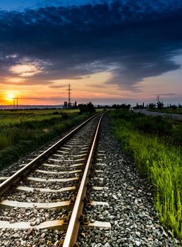 Railroad with orange sunset, Romania.