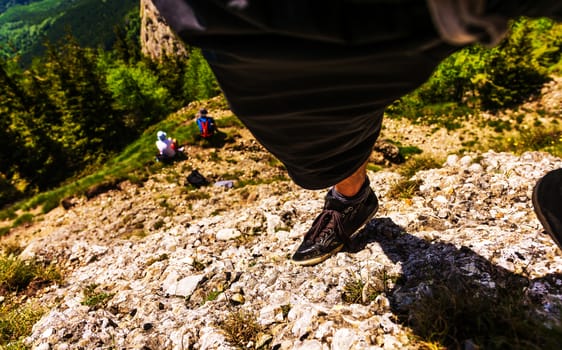Leg of a climber on rock.