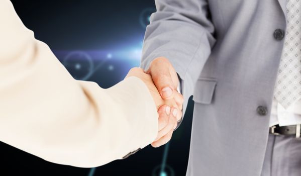 People in suit shaking hands against glowing background with lines