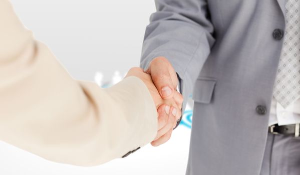 People in suit shaking hands against online community