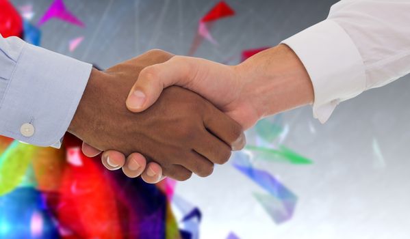 Close-up shot of a handshake in office against geometric design