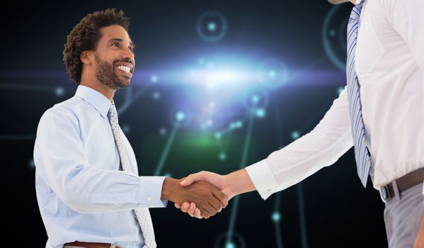 Two businessmen shaking hands in office against glowing background with lines