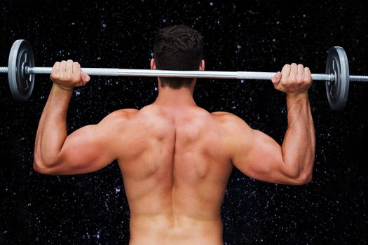 Bodybuilder lifting barbell against black background