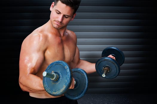 Bodybuilder lifting dumbbell against black background