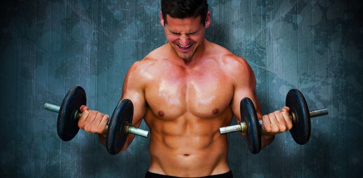 Bodybuilder lifting dumbbells against blue paint splashed surface