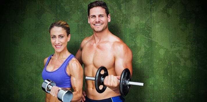 Bodybuilding couple against green paint splashed surface