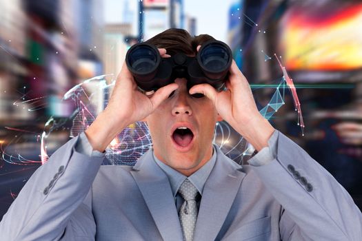 Suprised businessman looking through binoculars against global technology background in blue