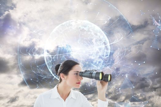 Business woman looking through binoculars against global technology background in blue