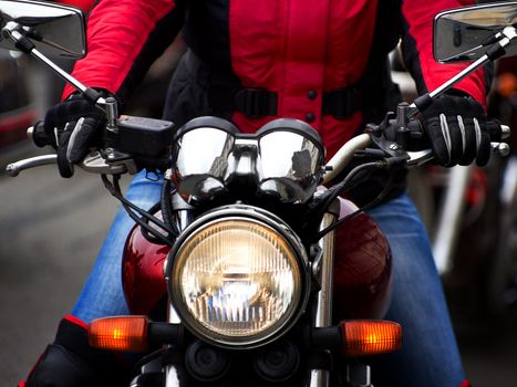 Motorcycle rider rushing at city street