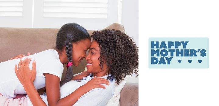 mothers day greeting against pretty mother lying on the couch with her daughter