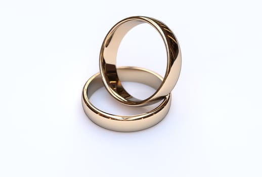 Golden wedding rings on white background, close up 