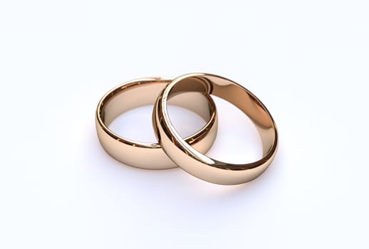 Golden wedding rings on white background, close up 