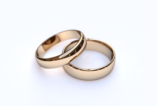 Golden wedding rings on white background, close up 