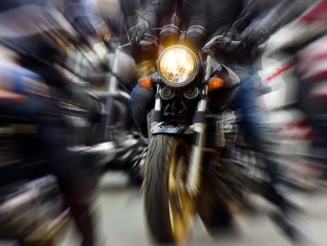 motorcycle rushing at city street, blurred motion