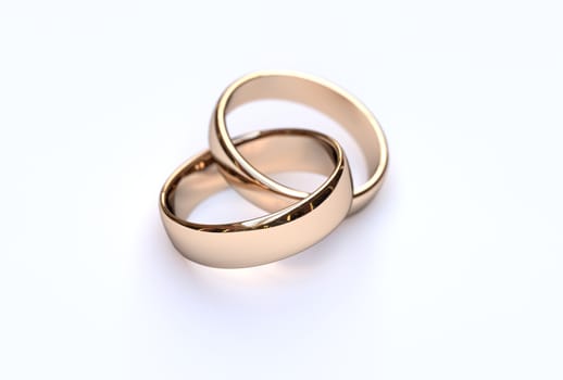 Golden wedding rings on white background, close up 