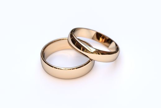 Golden wedding rings on white background, close up 