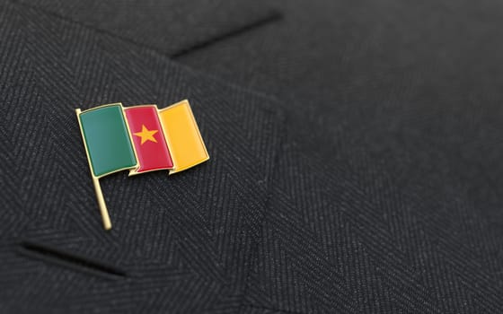Cameroon flag lapel pin on the collar of a business suit jacket shows patriotism