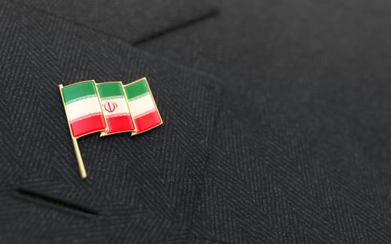 Iran flag lapel pin on the collar of a business suit jacket shows patriotism