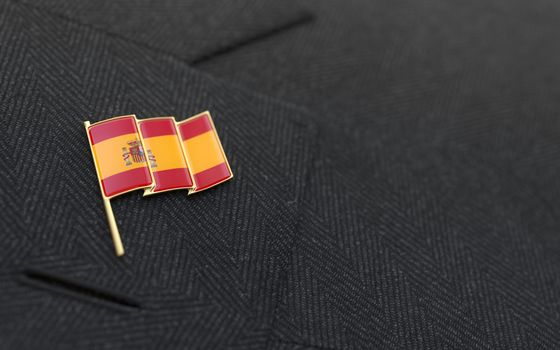 Spain flag lapel pin on the collar of a business suit jacket shows patriotism