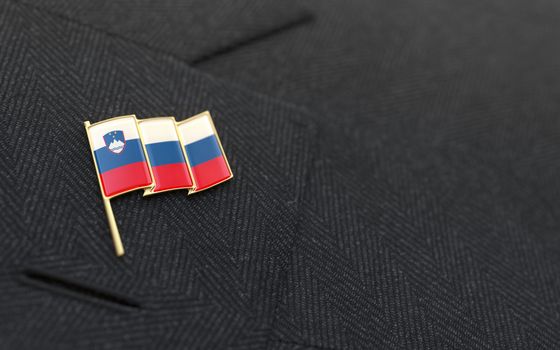 Slovenia flag lapel pin on the collar of a business suit jacket shows patriotism