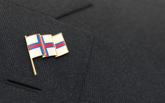 Faroe Islands flag lapel pin on the collar of a business suit jacket shows patriotism