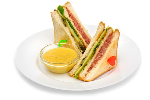 Club sandwiches with dip sauce on the plate