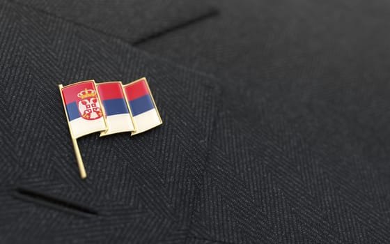 Serbia flag lapel pin on the collar of a business suit jacket shows patriotism