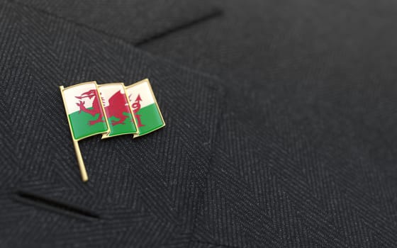 Wales flag lapel pin on the collar of a business suit jacket shows patriotism