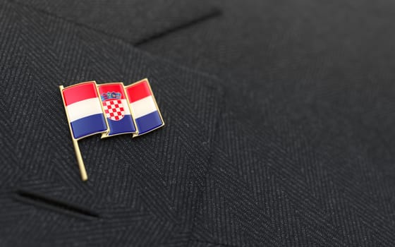 Croatia flag lapel pin on the collar of a business suit jacket shows patriotism