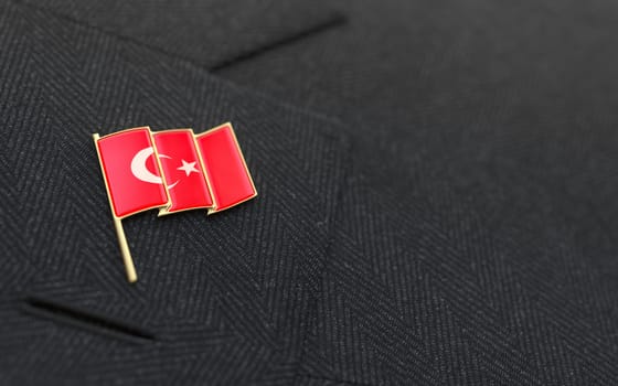 Turkey flag lapel pin on the collar of a business suit jacket shows patriotism