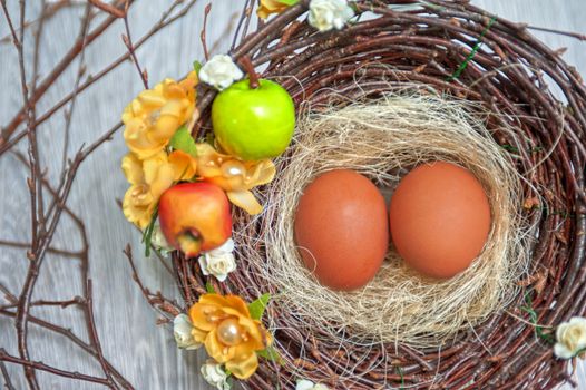 eggs in nest on a wooden background for easter