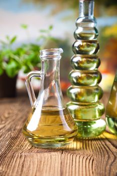 Olive oils in bottles, Mediterranean rural theme