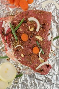 Raw beef meat seasoned and ready to cooked