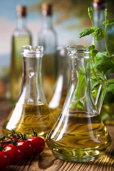 Olive oils in bottles, Mediterranean rural theme
