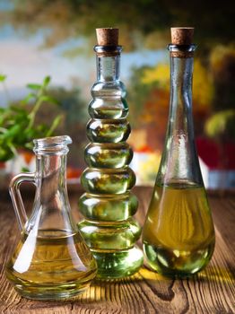Olive oils in bottles, Mediterranean rural theme