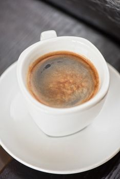 Cup of coffee closeup shot from above