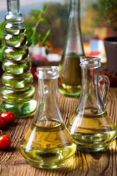 Olive oils in bottles, Mediterranean rural theme