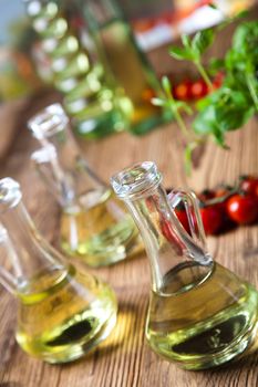 Olive oils in bottles, Mediterranean rural theme
