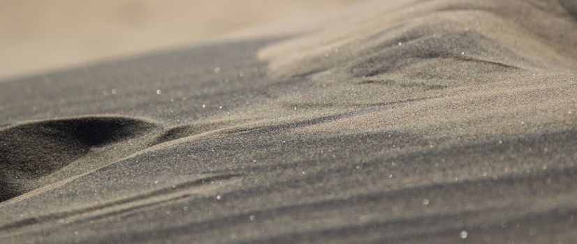 Colors and textures in desert sand.