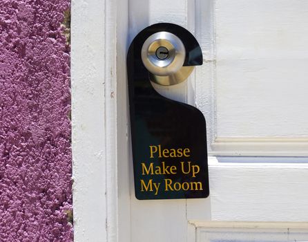 Please make up my room sign on door knob in hotel