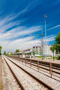 Railway goes to horizon near station Leptokarya, Greece