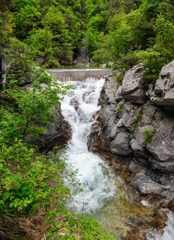 Waterfall in Olympus Mountains, highest in the Greece. Panorama stitched from two shots