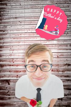 Geeky hipster holding a red rose against wooden planks