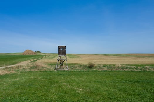 Wooden Hunters High Seat hunting tower in rural Landscape, Czech Republic Scenery 