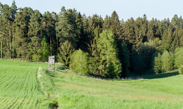 Wooden Hunters High Seat hunting tower in rural Landscape, Czech Republic Scenery