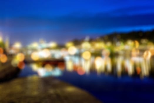 Blured lights from night Prague, view from river Vltava
