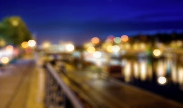 Blured lights from night Prague, view from river Vltava